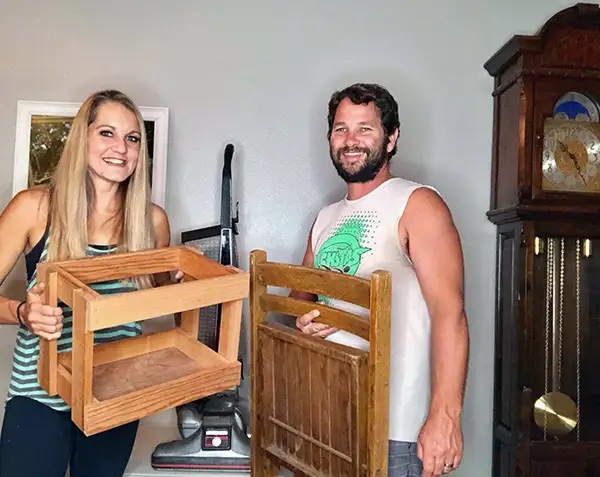 Rob and Melissa Stephenson holding items they flipped