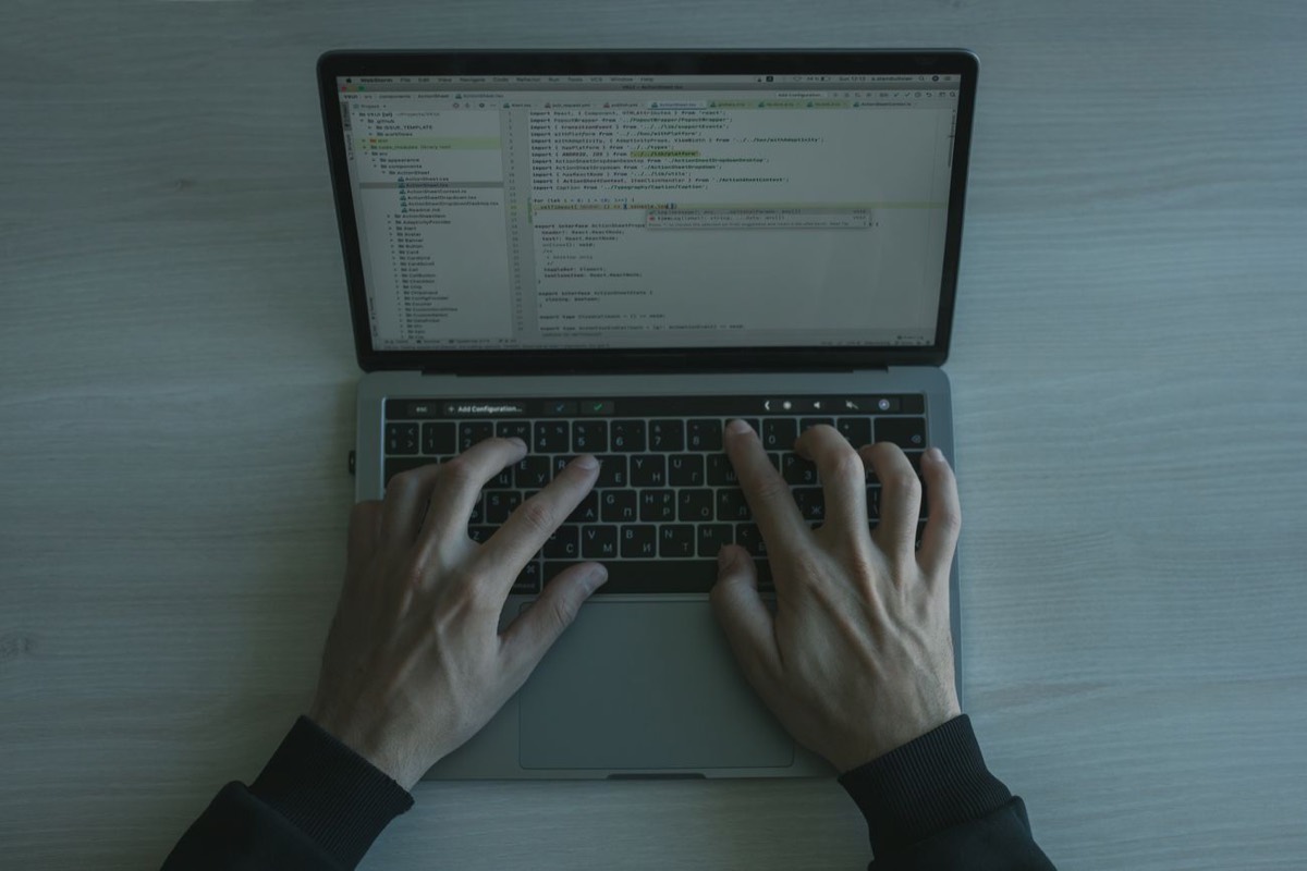 A solo developer coding at a home desk (illustrative)