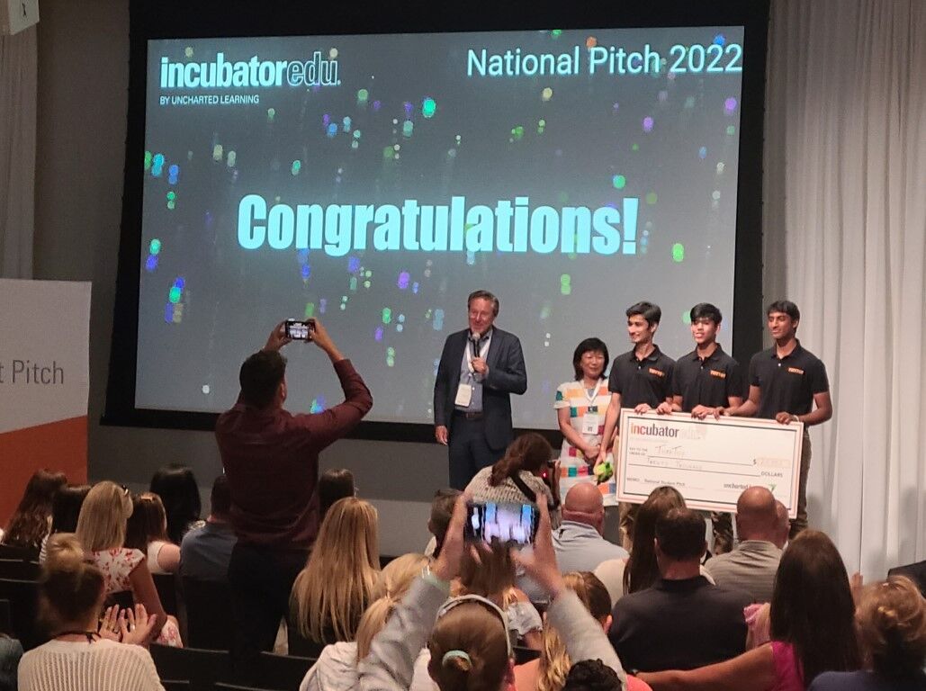 TuffToy founders on stage winning $20K at INCubatoredu National Pitch 2022 Chicago
